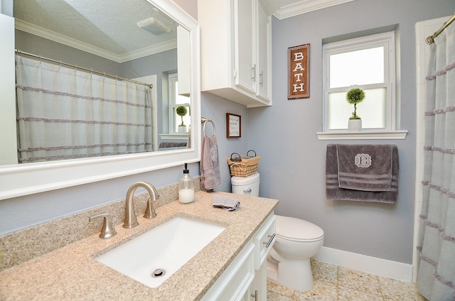 bathroom with vanity, crown molding, a textured ceiling, and toilet