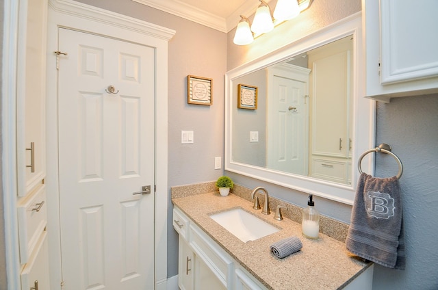 bathroom with vanity and crown molding