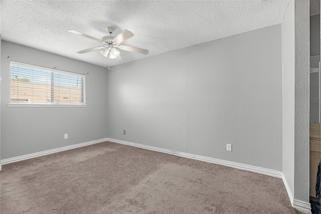 unfurnished room with carpet flooring, a textured ceiling, and ceiling fan