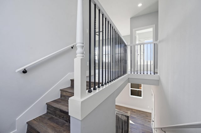 stairway featuring wood-type flooring