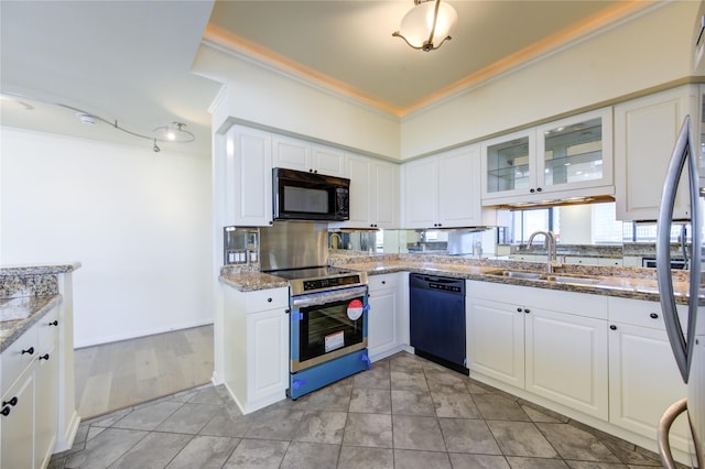 kitchen with sink, black appliances, white cabinets, and light stone countertops