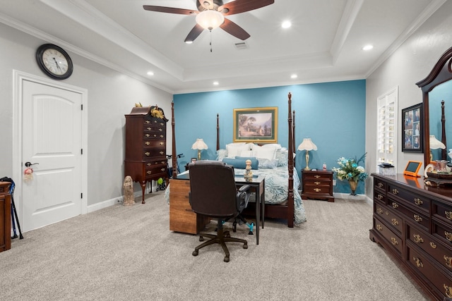 carpeted bedroom featuring a raised ceiling, crown molding, and ceiling fan