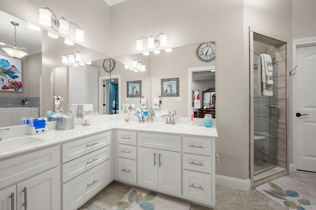 bathroom featuring vanity, an enclosed shower, and tile patterned flooring