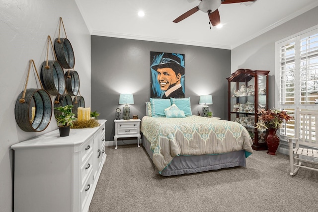 carpeted bedroom featuring crown molding and ceiling fan