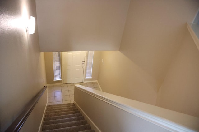 staircase with tile patterned flooring