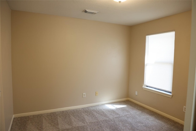 empty room featuring carpet flooring