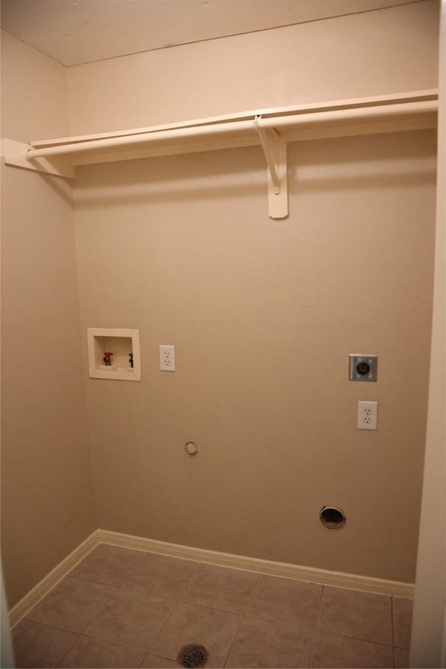 laundry area featuring gas dryer hookup, tile patterned floors, washer hookup, and hookup for an electric dryer