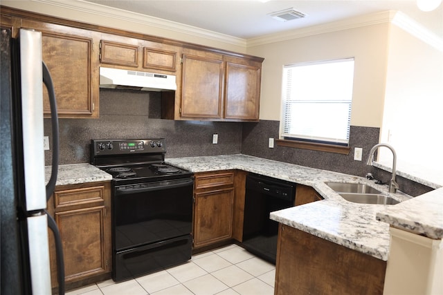 kitchen featuring sink, crown molding, tasteful backsplash, light stone counters, and black appliances