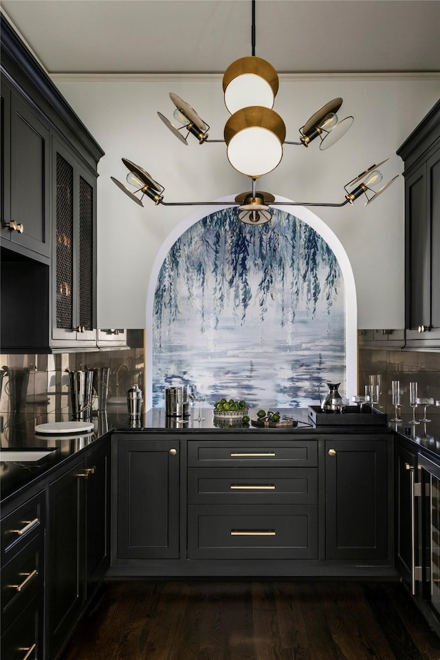 bar featuring wine cooler, dark wood-type flooring, and backsplash