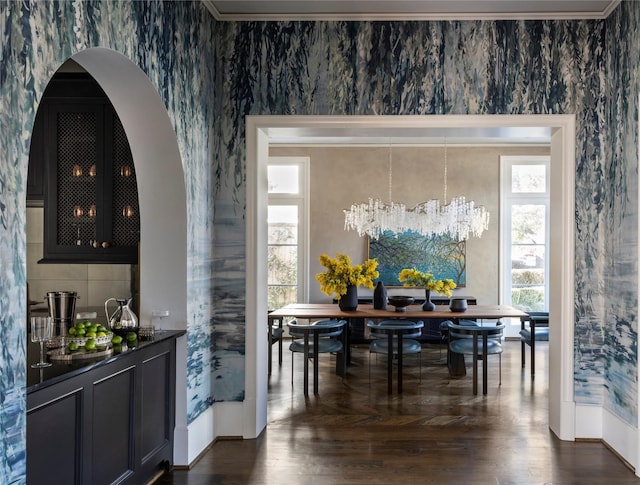 dining space with a chandelier and dark hardwood / wood-style flooring