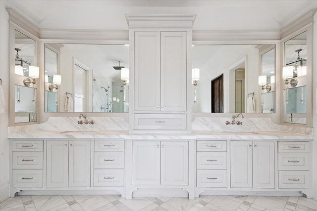 bathroom featuring vanity and a shower with door