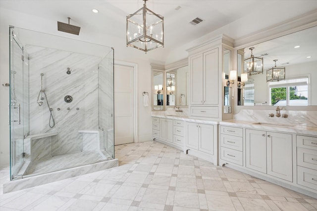 bathroom featuring vanity, an enclosed shower, and a notable chandelier