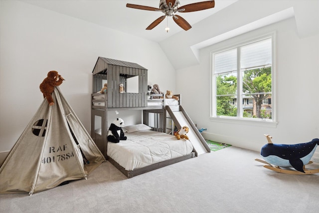 carpeted bedroom featuring ceiling fan and lofted ceiling