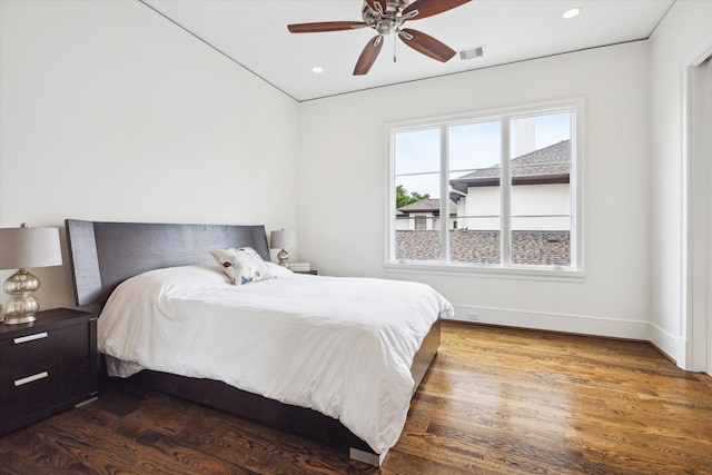 bedroom featuring dark hardwood / wood-style floors and ceiling fan