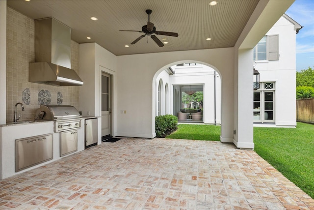 view of patio / terrace featuring sink, grilling area, ceiling fan, and exterior kitchen