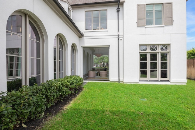 rear view of house with a yard