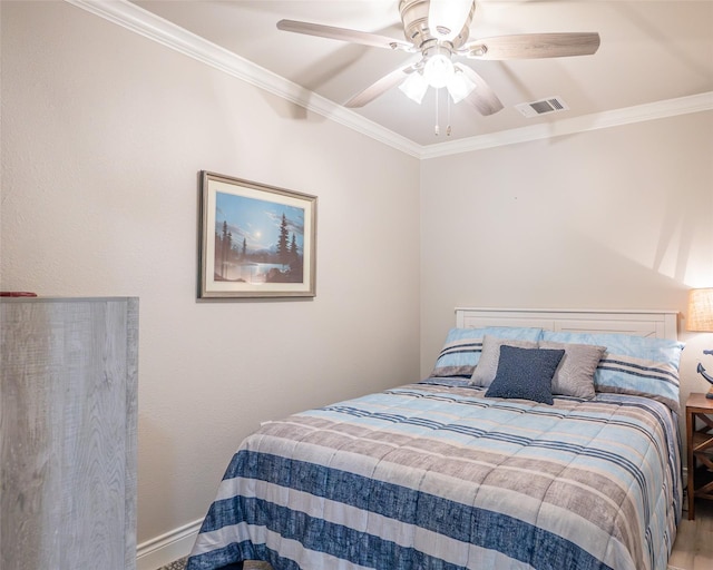 bedroom featuring ornamental molding and ceiling fan