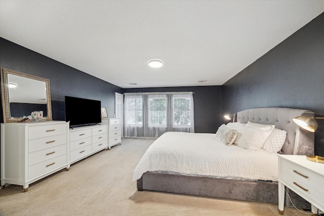 bedroom with light colored carpet