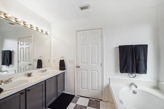 bathroom featuring vanity and a bathing tub