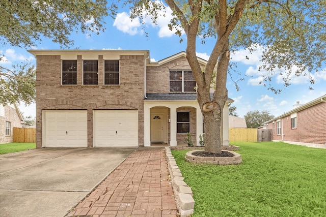 view of front facade with a front yard and a garage