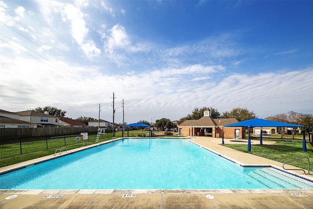 view of swimming pool featuring a lawn, a patio, and a gazebo