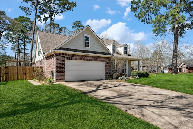 view of front of house featuring brick siding, a front yard, fence, a garage, and driveway