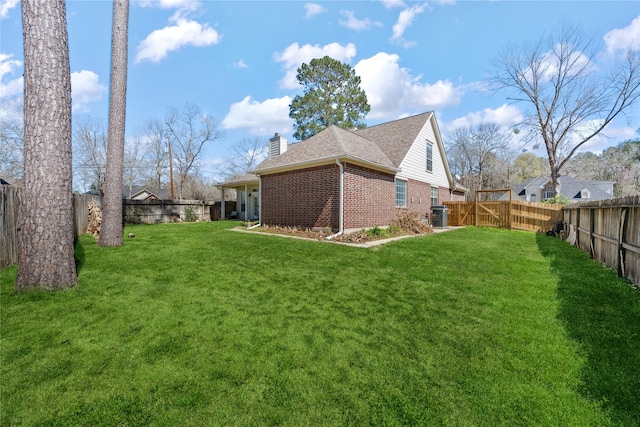 exterior space with central AC unit and a fenced backyard