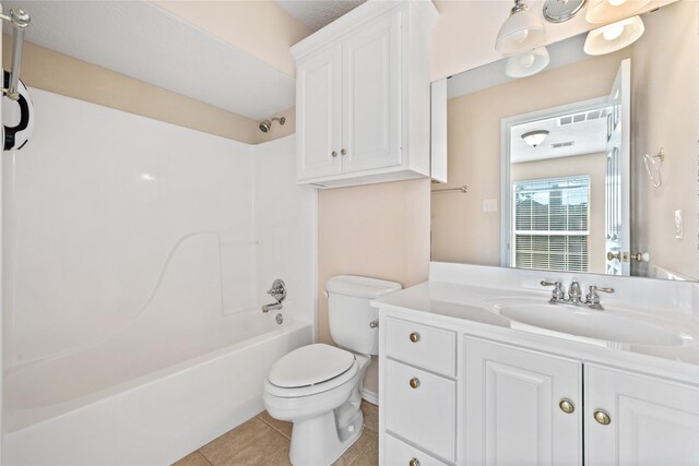 full bathroom featuring  shower combination, vanity, toilet, and tile patterned floors