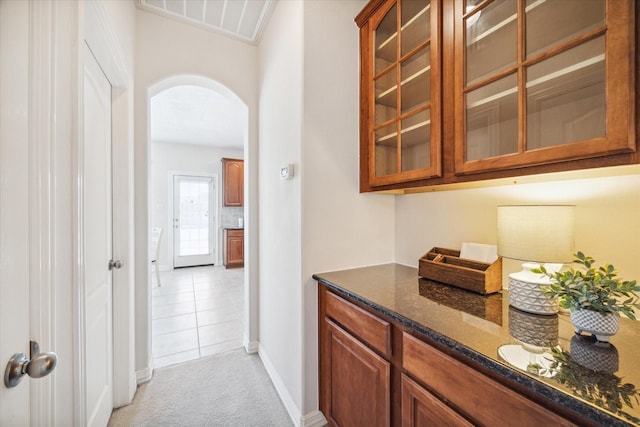 hallway featuring light colored carpet