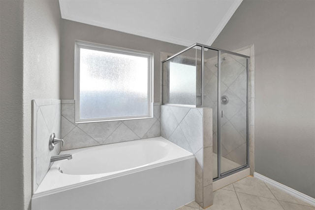 bathroom with plus walk in shower, vaulted ceiling, tile patterned floors, and crown molding