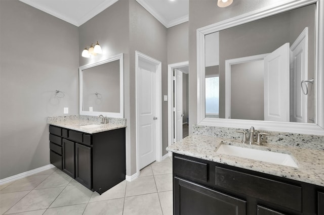 bathroom with crown molding, vanity, and tile patterned flooring