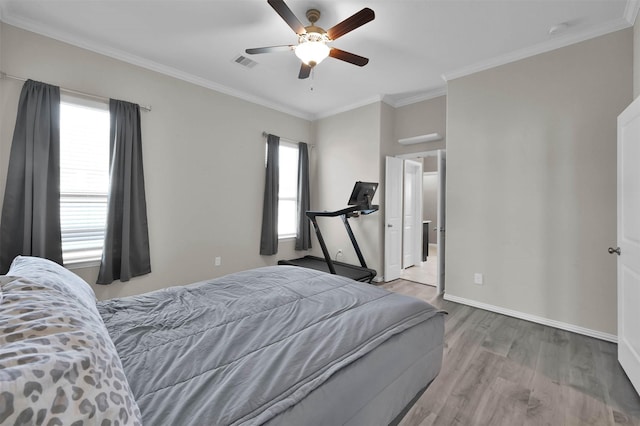 bedroom with hardwood / wood-style floors, crown molding, and ceiling fan