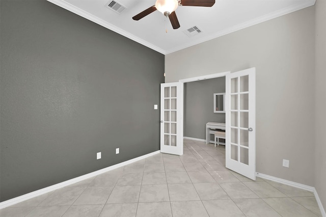 unfurnished room featuring ornamental molding, light tile patterned floors, ceiling fan, and french doors