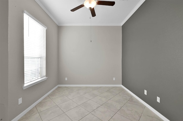 spare room featuring light tile patterned floors, crown molding, and ceiling fan