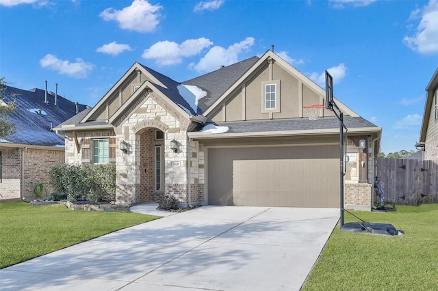 view of front of home featuring a garage and a front yard