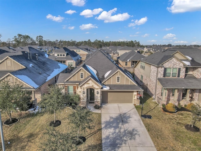 view of front of home featuring a garage and a front lawn