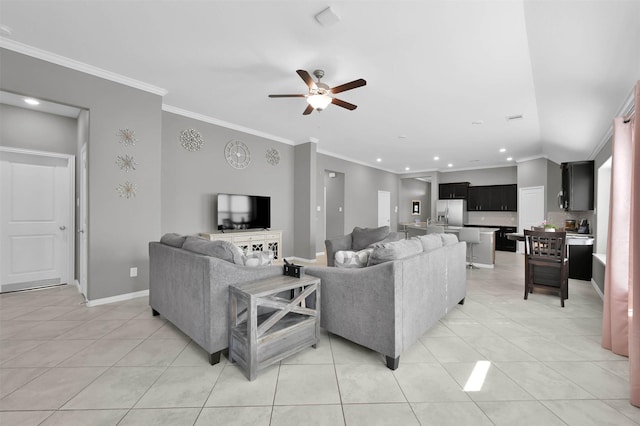 tiled living room featuring ceiling fan and ornamental molding