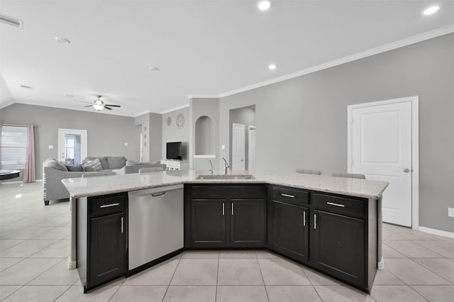 kitchen with a kitchen island with sink, sink, light tile patterned floors, and dishwasher