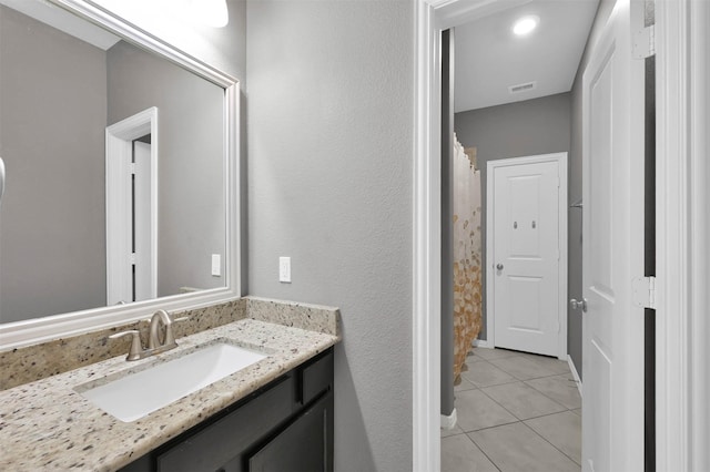 bathroom featuring tile patterned floors and vanity