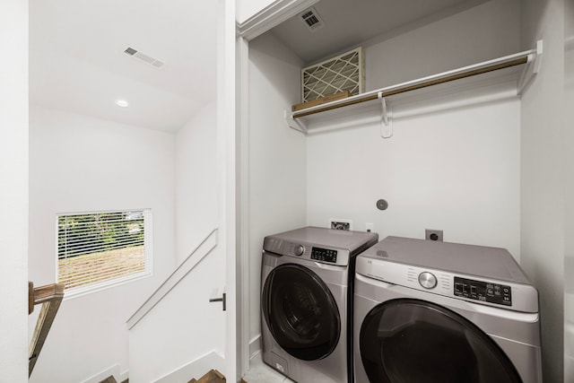 laundry room featuring separate washer and dryer