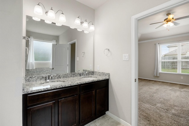 bathroom featuring ceiling fan and vanity