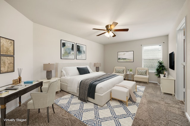 bedroom featuring ceiling fan and light carpet