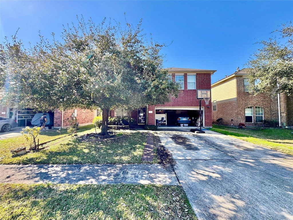 view of front of home with a garage and a front lawn