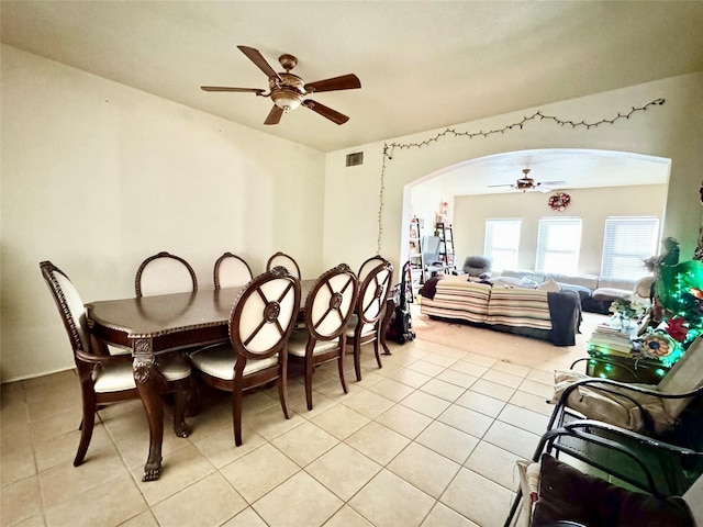 tiled dining room featuring ceiling fan