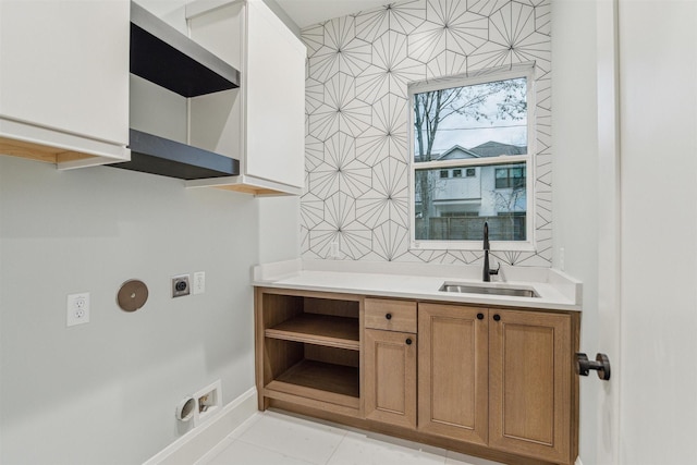 laundry room featuring light tile patterned flooring, sink, and hookup for an electric dryer