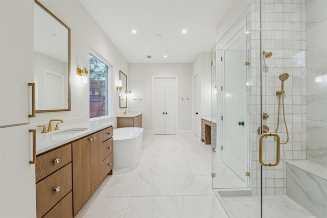 bathroom featuring vanity and independent shower and bath