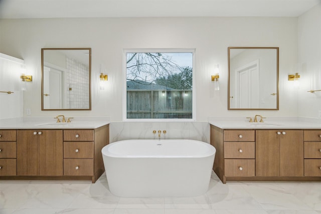 bathroom with vanity and a bathtub