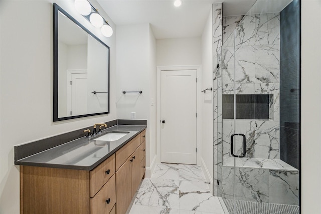 bathroom featuring walk in shower and vanity