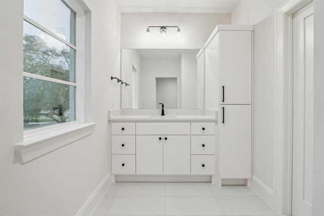 bathroom with tile patterned flooring and vanity