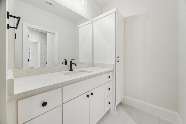 bathroom featuring vanity and tile patterned flooring